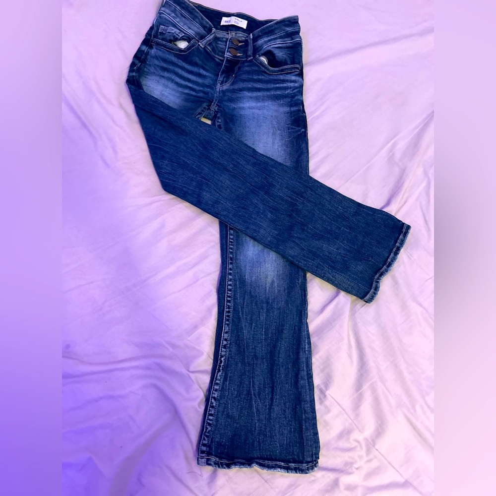 Woman’s buckle bootcut jeans